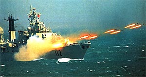 an awesome picture of a china navy frigate launching multiple response missile