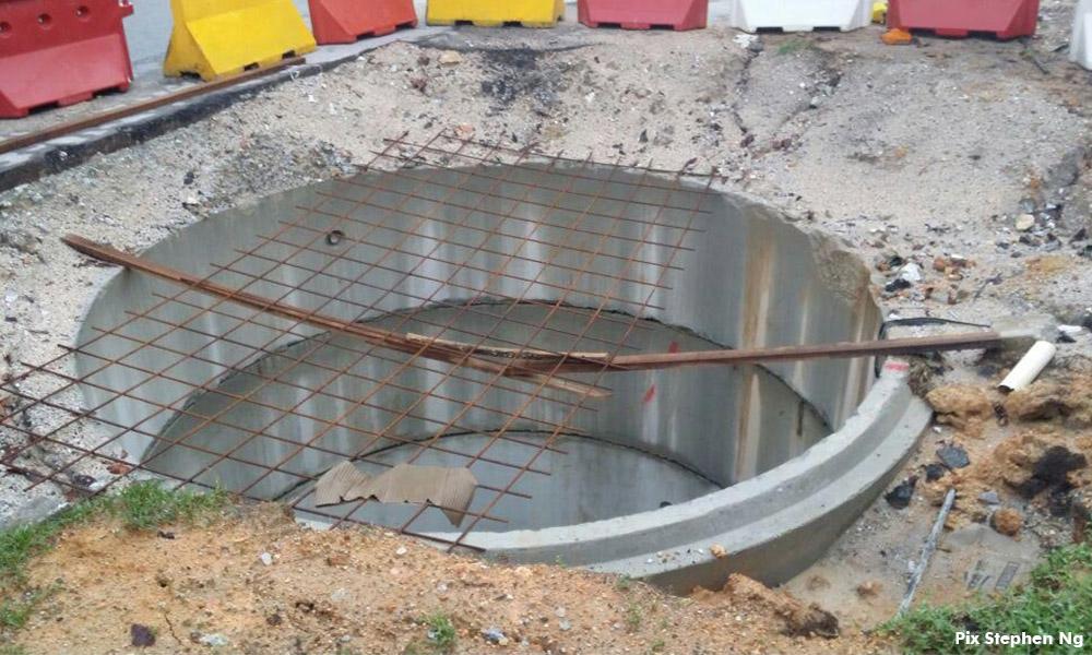 Following car-in-sewer-hole mishap, where are the authorities?