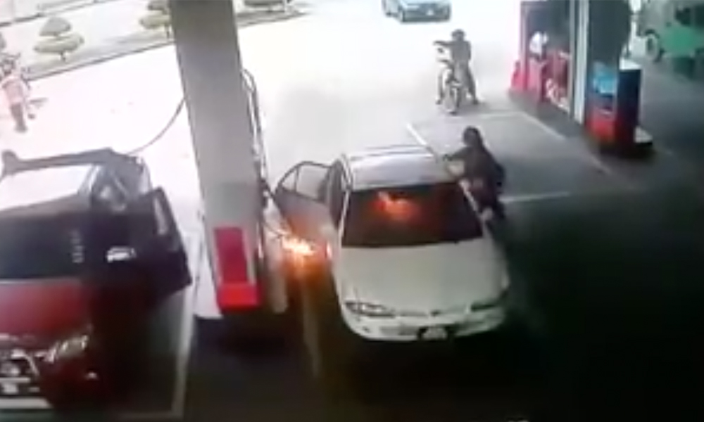 Car bursts into flames as child plays with lighter at petrol station