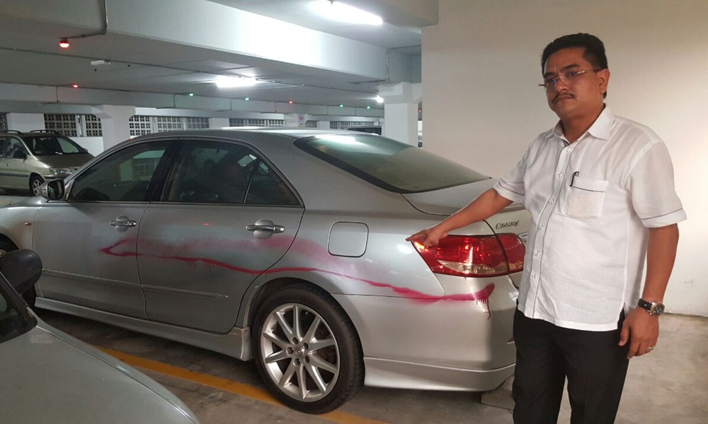 Ali Tinju’s vehicle sprayed with red paint just outside Bukit Aman