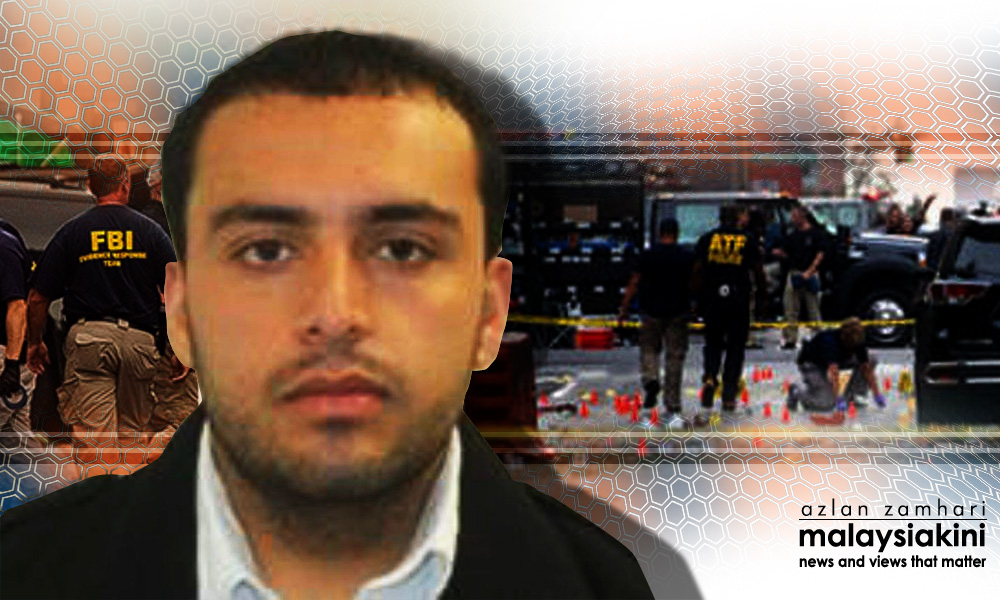 Suspect in US bombings charged with trying to murder police officer