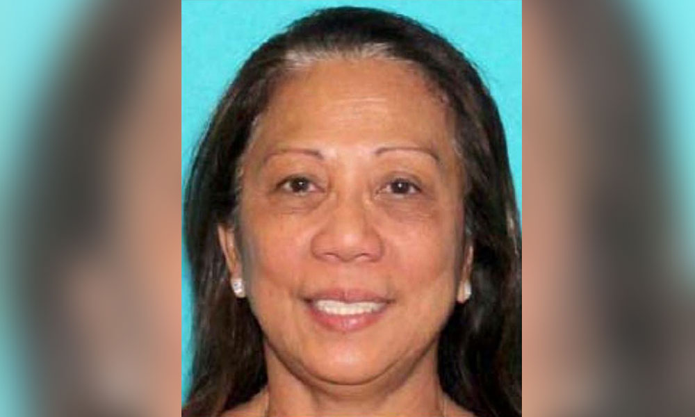 Gunman's girlfriend arrives in US to face probe