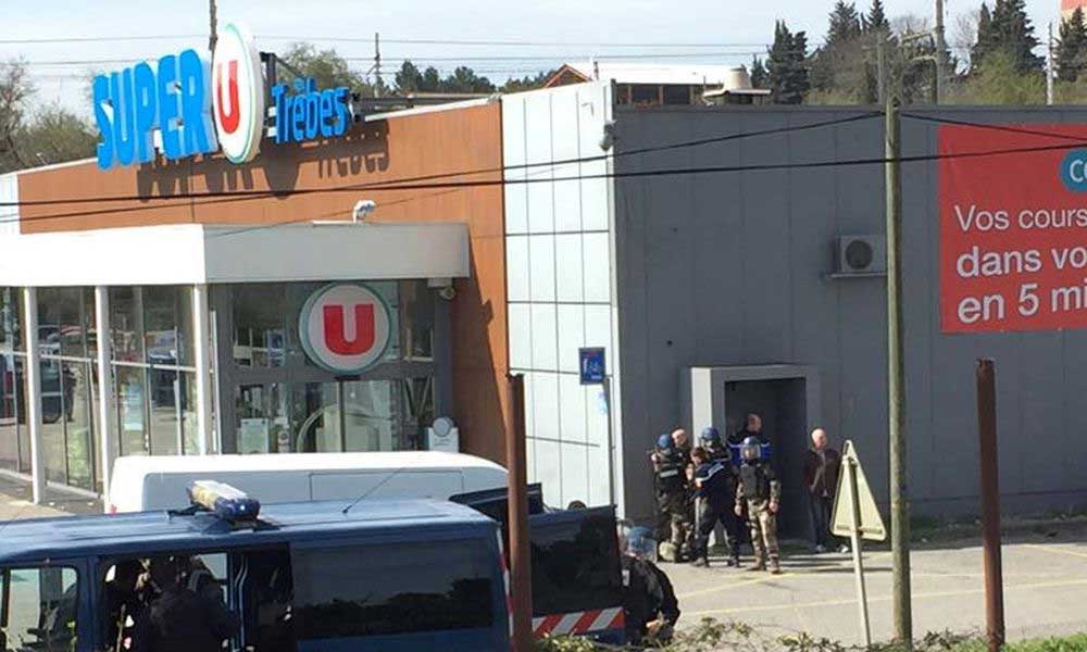 French cop fighting for his life after trading places with hostage