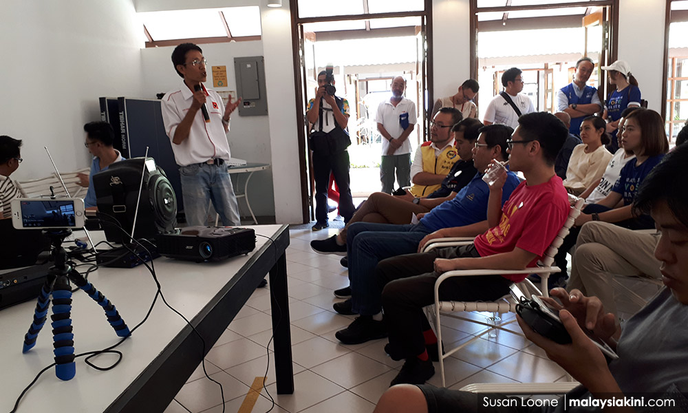 DAP's Zairil braves insults at condo residents' dialogue on hillslope project
