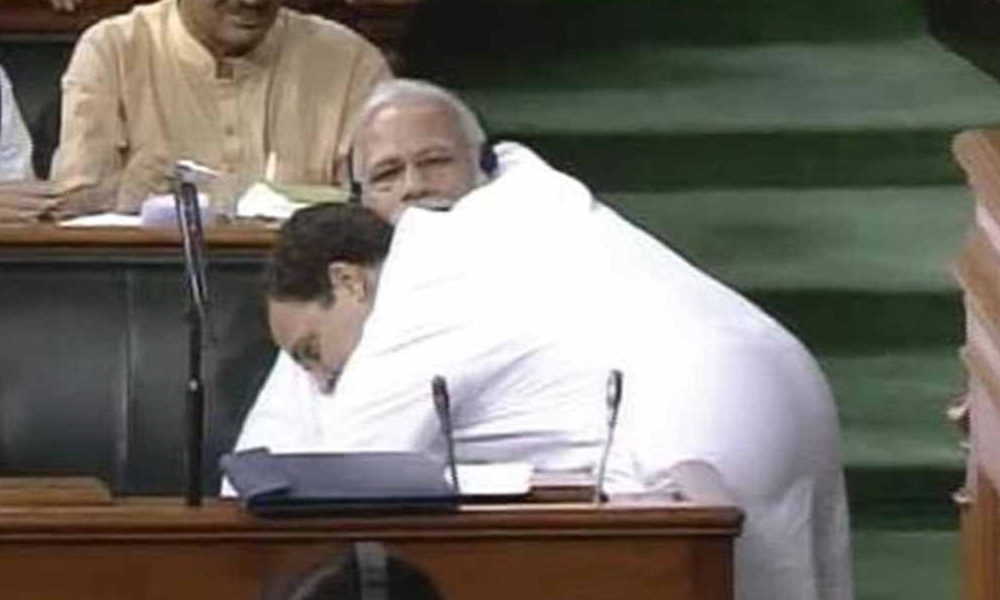 India's Modi stunned as rival Gandhi crosses parliament to hug him