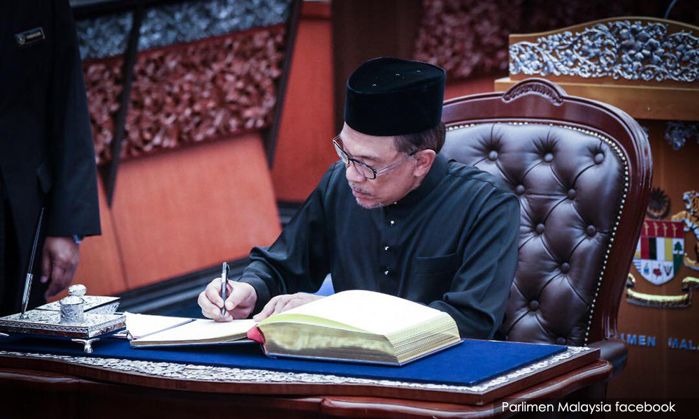 Anwar takes his seat in Parliament; RM6.38m for PM's overseas trips