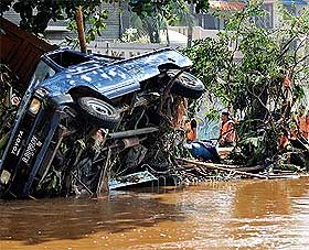 river dam burst in indonesia 270309 01