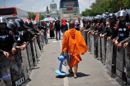 Thai troops battle protesters in Bangkok streets.