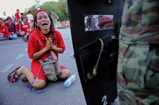 Thai troops battle protesters in Bangkok streets.