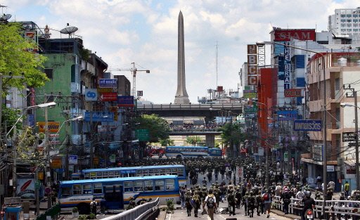 Thai troops battle protesters in Bangkok streets.