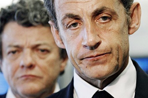 Grim-faced French President Nicolas Sarkozy