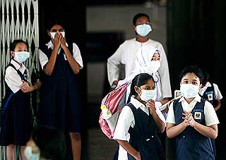 h1n1 flu malaysia school children students wearing mask 260609 03