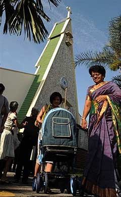 A Malaysian Christian family leaves a church after a Sunday service in Petaling Jaya