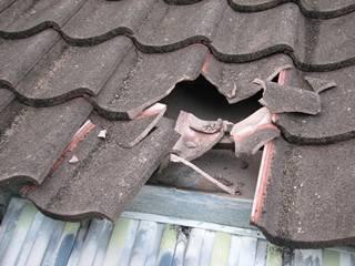 tiles broken by stones from blast site penang