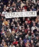 football racism 161105 fan with banner