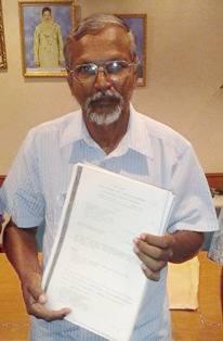 krishnan spokesperson holding some documents