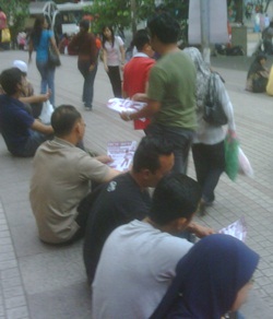 pas handing out leaflets on price hikes 2
