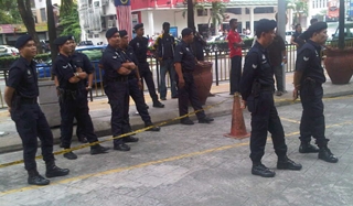 may day march 010511 police watch sit in at suhakam