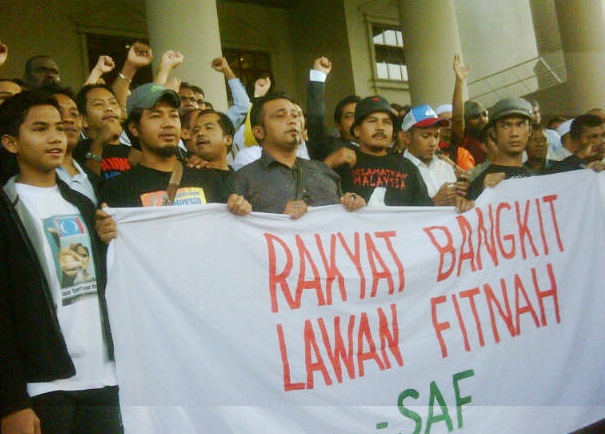 anwar ibrahim sodomy II trial decison on prima facie supporters outside court banners