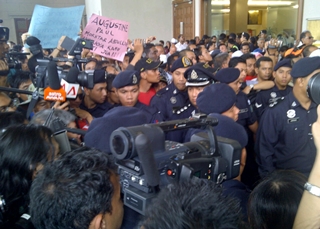court anwar trial 160511 police and crowd waiting for anwar exit