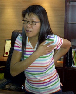 Wong bee fong demonstrating how she was molested by police