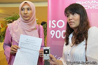 teo nie ching and nurul lodge report mcmc over anwar obscene mms 260312 01