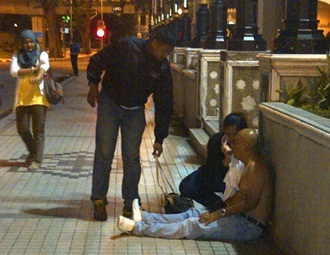 student injured by thugs in occupy dataran merdeka