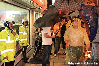 killthebill bersih 2 one year anniversary vigil 070912 marching by two police officers