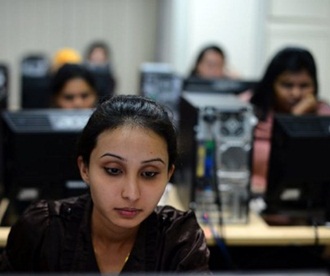Students prepare for an exam in front of their computers 2