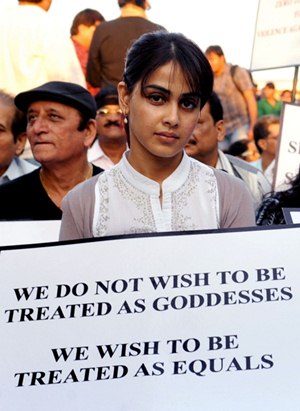 Indian Bollywood actress Genelia D'Souza in a candlelight vigil after the death of a gangrape victim