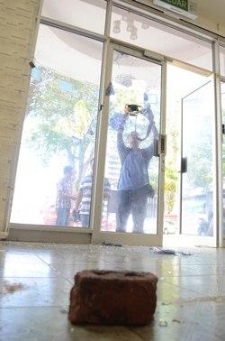 penang gerakan hq brick thrown through glass door 2