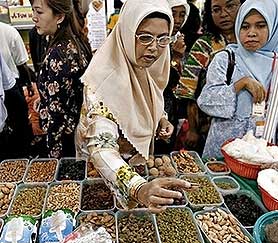 halal food convention woman buying inspecting food 121206