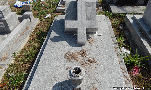 Broken crosses at Christian cemetery