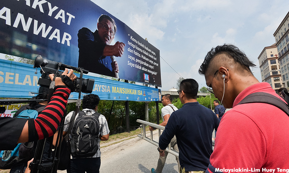 IGP will act on arson threats but says 'seditious' Anwar billboards must go