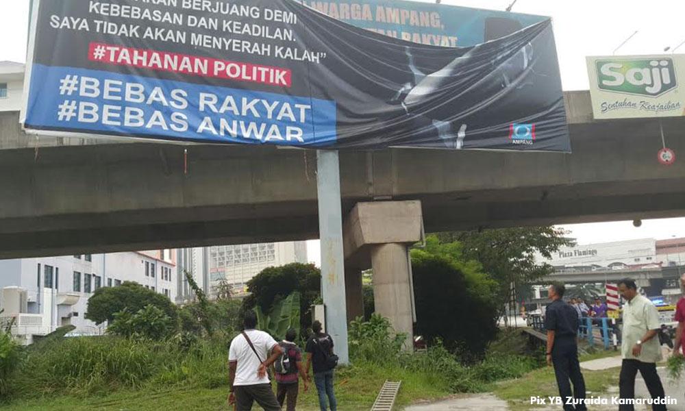 Police take down 'Free Anwar' billboards in Ampang